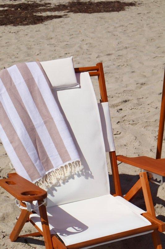 Luxury blue and white striped beach cabana setup