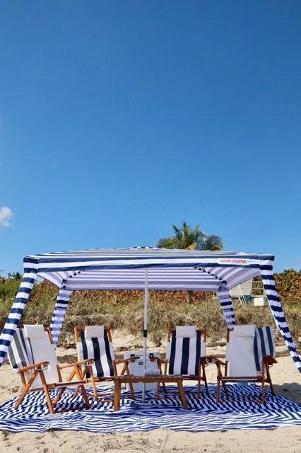 Beach cabana setup with ocean backdrop